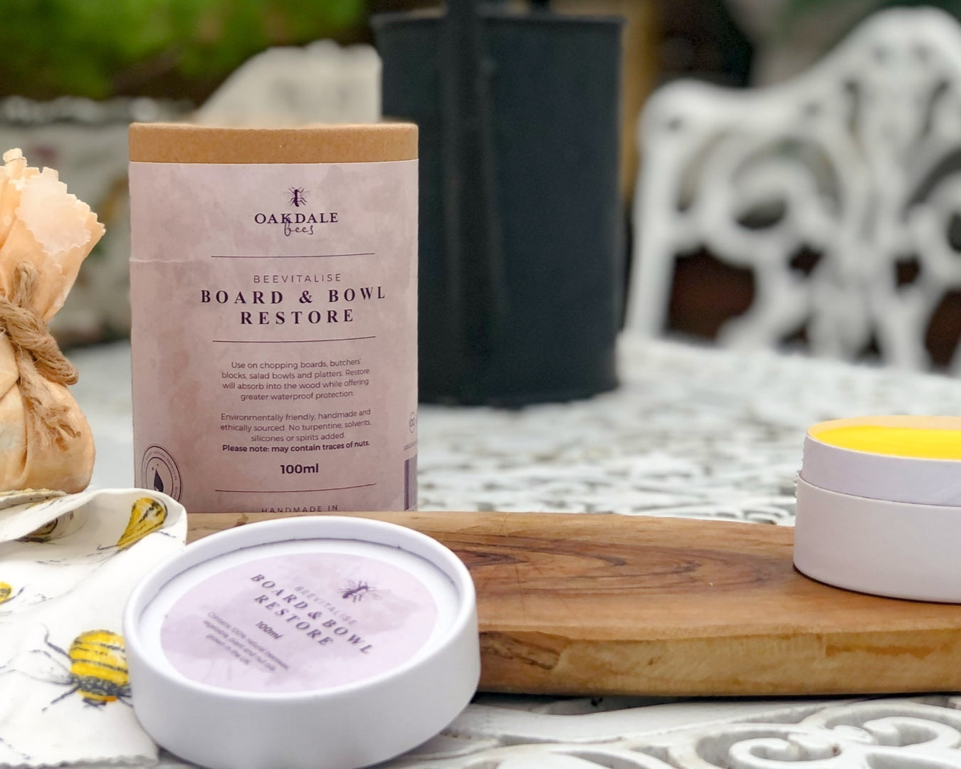 Oakdale Board & Bowl Restore product on a table with a wooden board and containers.